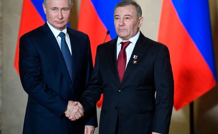 Russian President Vladimir Putin decorates oligarch Arkady Rotenberg with the Hero of Labour medal during an awards ceremony for those who led the construction of the Crimean Bridge over the Kerch Strait, which that links mainland Russia to Moscow-annexed Crimea.