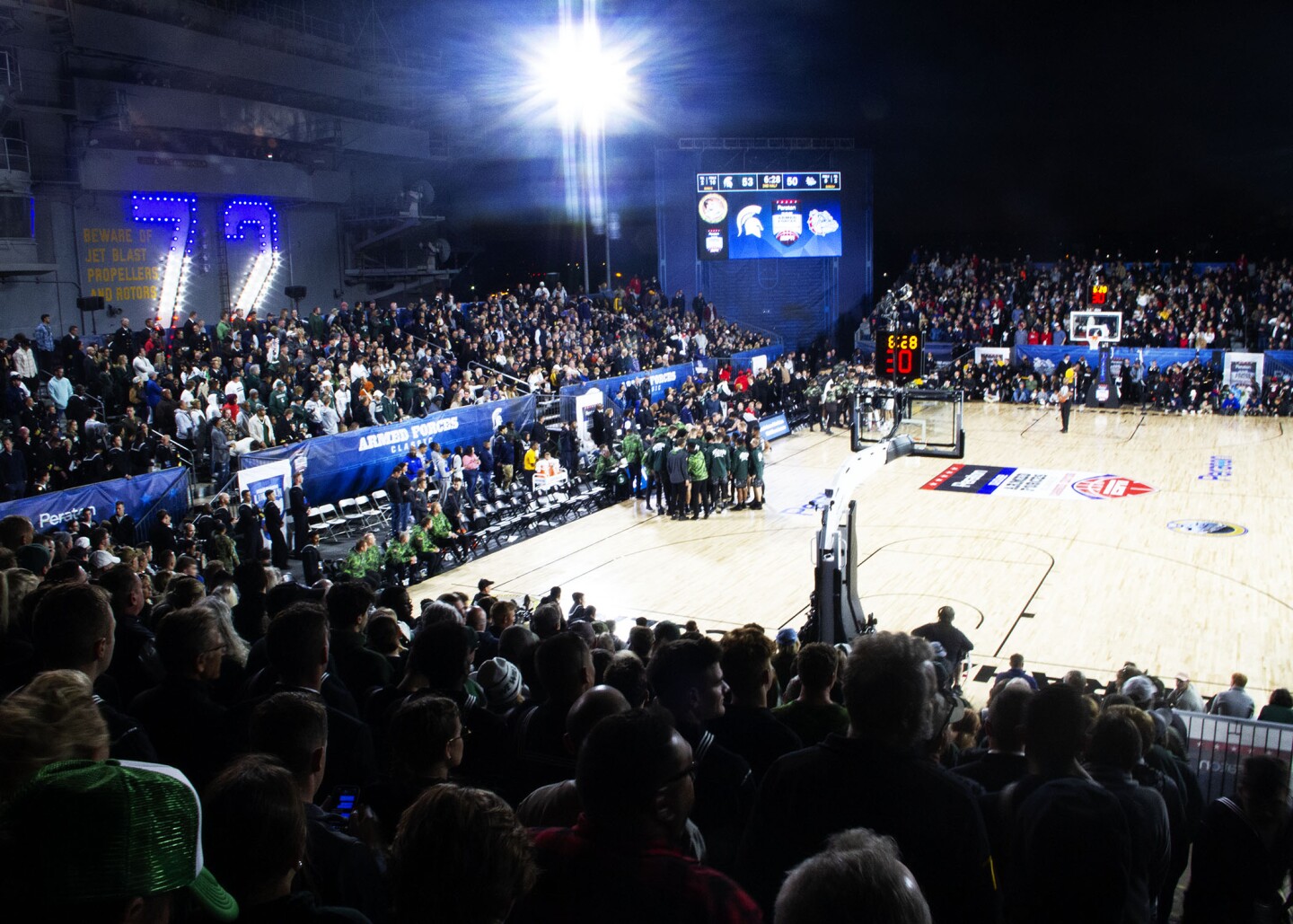 Gonzaga and MSU huddle during a media timeout at the Armed Forces Classic on board USS Abraham Lincoln in San Diego on Nov. 11, 2022.