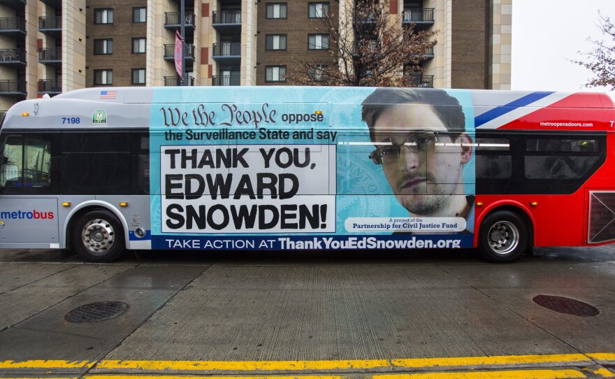 An advertisement thanking NSA leaker Edward Snowden appears on the side of a Metrobus in downtown Washington, D.C., in November.