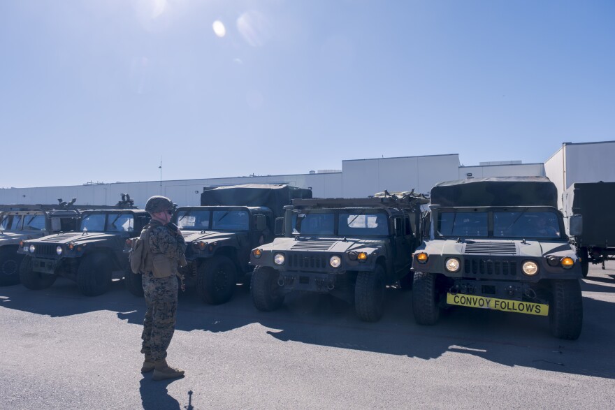 Marines line up in Humvees and 7-ton trucks on Marine Corps Air Station Miramar heading just east of the I-15 freeway for a training exercise, October 22, 2024.
