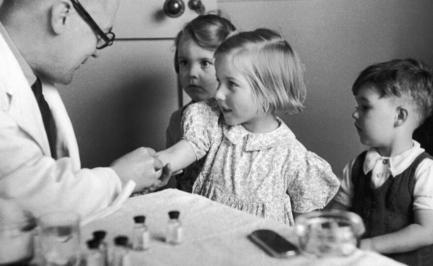 Children get their diphtheria inoculation in 1944.