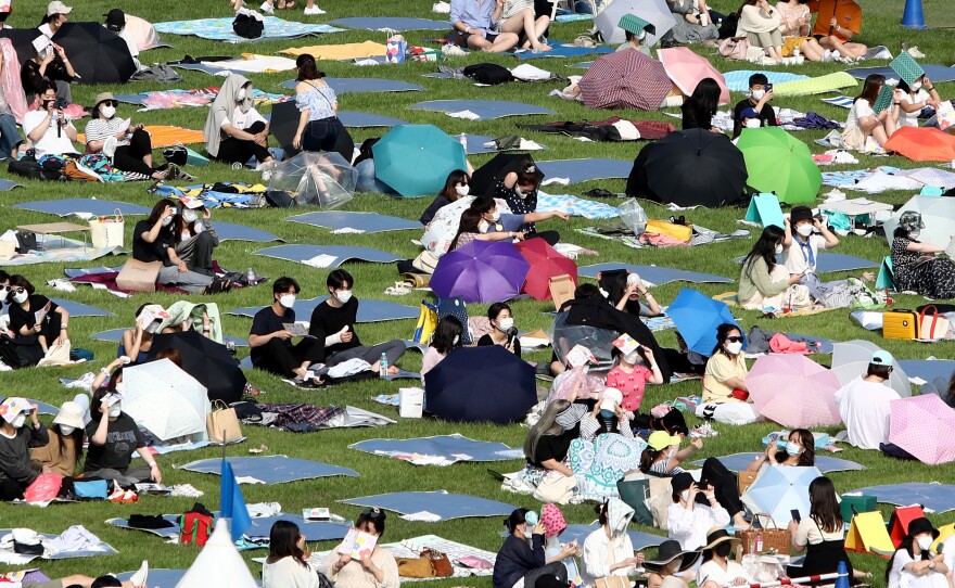 Festivalgoers attend a music festival at Olympic Park on June 26, 2021 in Seoul, South Korea.