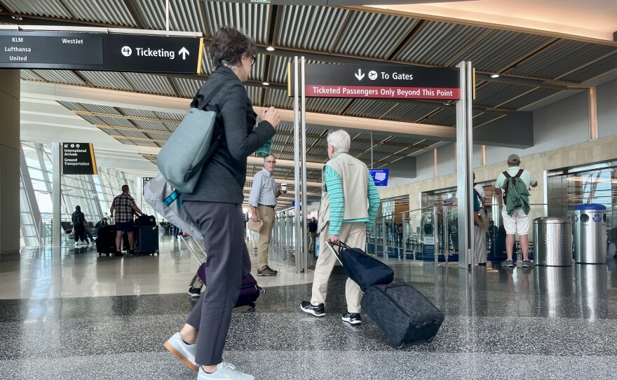 Passengers walk inside of San Diego International Airport's Terminal 2, Oct. 9 , 2025.