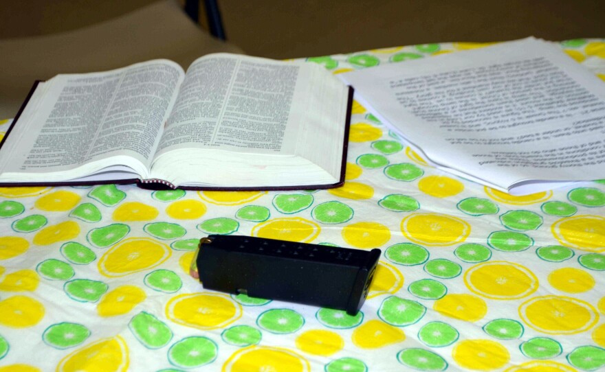 A loaded gun magazine rests on a table next to an open Bible in June 2015 at Emanuel African Methodist Episcopal Church, after a shooting at a Bible study that left nine attendees dead.