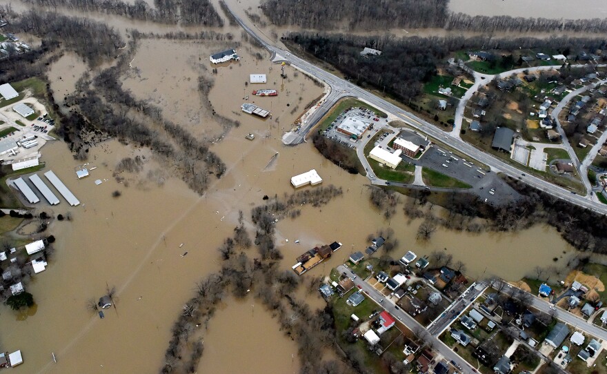 Submerged roads and houses are seen after several days of heavy rain led to flooding, in an aerial view over Union, Mo., on Tuesday.