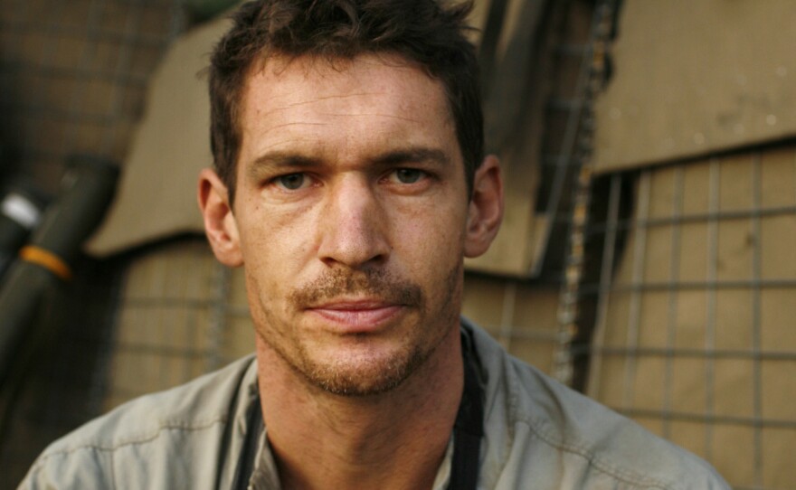 Photographer Tim Hetherington during an assignment for <em>Vanity Fair Magazine</em> at the Restrepo outpost.