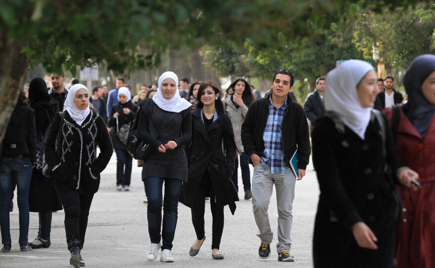 Syrian students on campus at a Damascus university in 2012, a year after the war started.