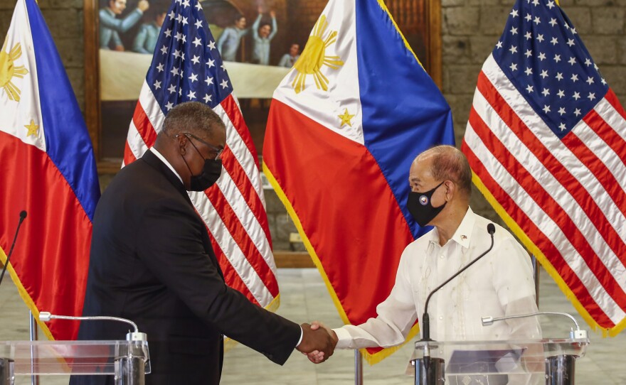 U.S. Defense Secretary Lloyd Austin, left, and Philippines Defense Secretary Delfin Lorenzana shake hands after a bilateral meeting at Camp Aguinaldo military camp in Quezon City, Metro Manila, Philippines Friday, July 30. Austin is visiting Manila to hold talks with Philippine officials to boost defense ties and possibly discuss the The Visiting Forces Agreement between the US and Philippines.