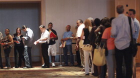 People stand in line as they attend the HOPE NOW event which helps homeowners speak to their bank personnel to go over their mortgage issue at the Westin Diplomat Resort & Spa on July 11, 2011 in Hollywood, Florida.
