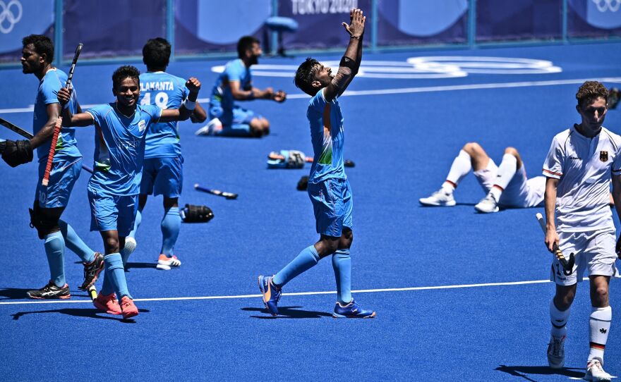 Indian field hockey players celebrate after winning the men's bronze medal match over Germany at  the Tokyo 2020 Olympics.