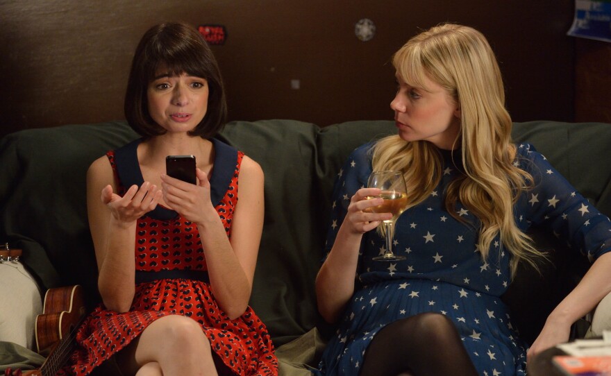 Kate Micucci (left) and Riki Lindhome play a fictional version of their real-life joke-folk duo Garfunkel and Oates in a new scripted comedy on IFC.