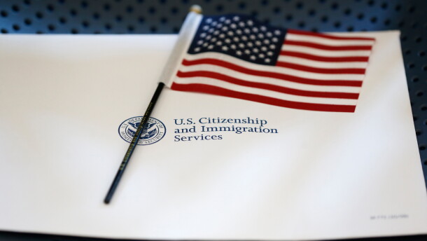 An information packet and an American flag are placed on a chair at the U.S. Citizenship and Immigration Services Miami Field Office on Aug. 17, 2018, in Miami.