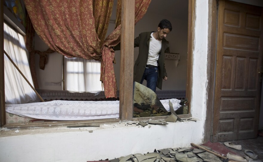 On Saudi Arabia's southern border with Yemen, there is another uprising, where Shiite rebels, known as Houthis, linked to Iran, recently swept into the capital, Sanaa. Here, a Shiite Houthi man stands inside his house after a bomb explosion, in Sanaa, Yemen, on Monday.