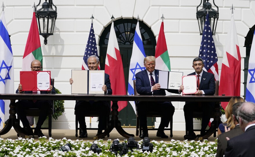 President Donald Trump with, from left, Bahrain Foreign Minister Khalid bin Ahmed Al Khalifa, Israeli Prime Minister Benjamin Netanyahu, Trump, and United Arab Emirates Foreign Minister Abdullah bin Zayed al-Nahyan, during the Abraham Accords signing ceremony on the South Lawn of the White House, on Sept. 15, 2020.
