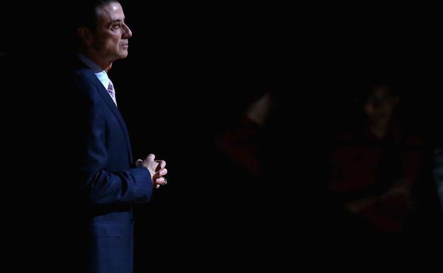 Rick Pitino receives a pre-game introduction at a Louisville Cardinals basketball home game in late 2015. The former coach has written a new memoir addressing the scandals that plagued his tenure at Louisville.