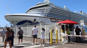 Pedestrians walk past the Ruby Princess docked at San Diego's Broadway Pier on Monday, Sept. 14, 2026.
