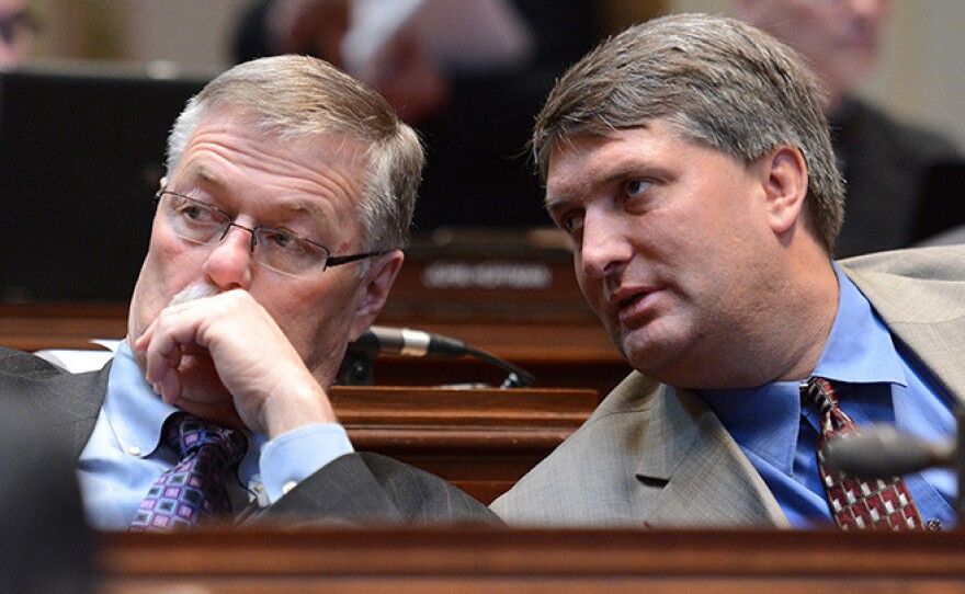 Minnesota State Sens. Bill Ingebrigtsen, left, and Torrey Westrom listen to floor debate during a Senate session in 2014.
