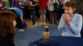 In the final hour from Eugene, Oregon, this guest is floored by appraiser Sarah Churgin’s evaluation of her circa 1960 jeweled gold moretto. This “guardian of Venice” was crafted by Giulio Nardi, well known for supplying jeweled accessories to the likes of Princess Grace of Monaco and Elizabeth Taylor. Churgin values the heavily gem-encrusted 18 karat gold-onyx figure at $40,000 to $60,000.