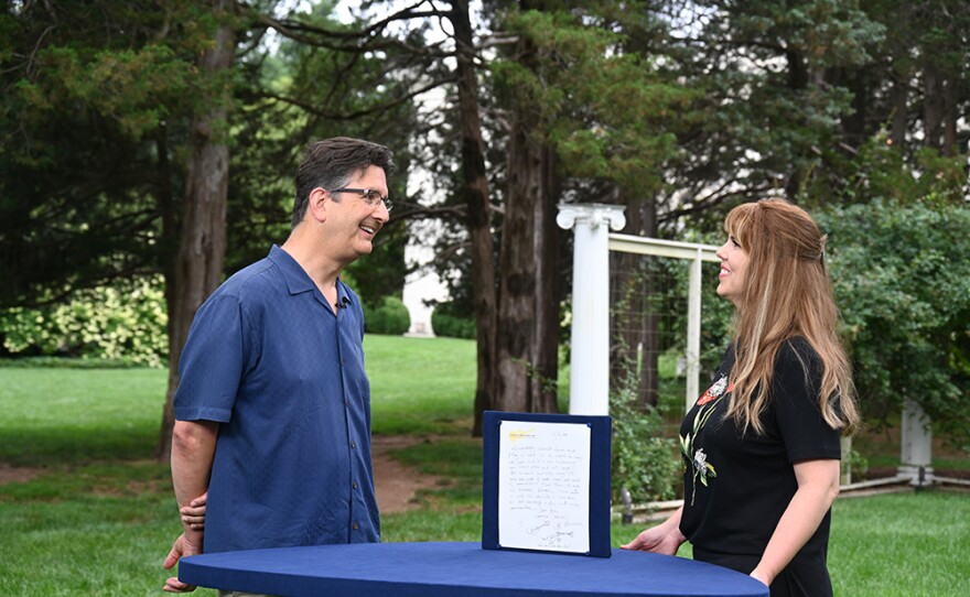 Laura Woolley (right) appraises a 1999 George Harrison letter, in Middletown, Conn.