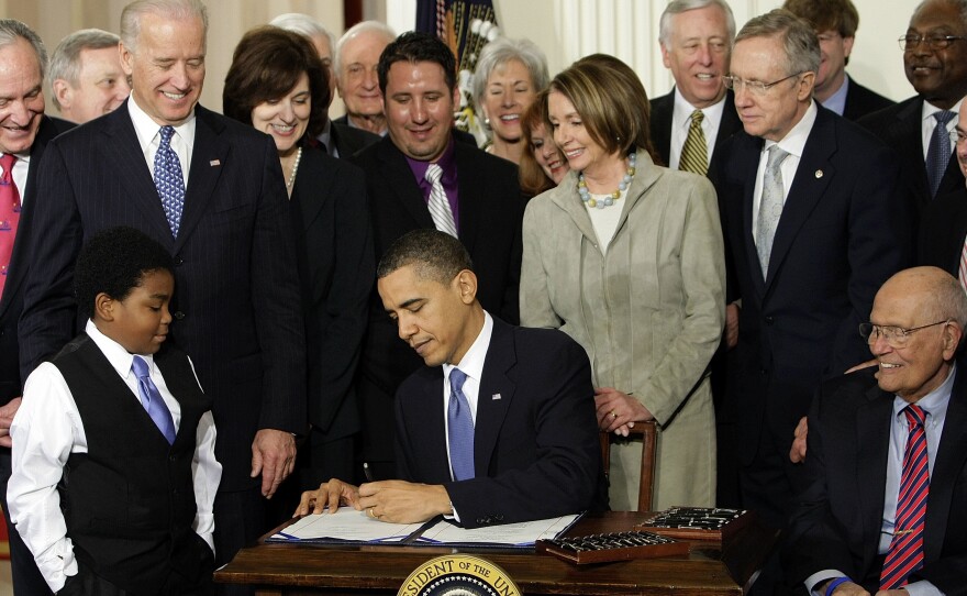Then-President Barack Obama signs the Affordable Care Act in March 2010. Later that year, Democrats lost dozens of House seats.