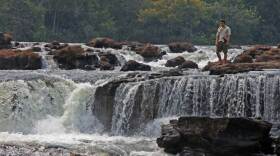 Niall McCann, explorer/biologist, at Kamukuakua Falls in the Mato Grosso, Brazil. Sacred to the Bakairi Indians, the waterfall is one of the signposts for Colonel Percy Fawcett’s Lost City of Z.