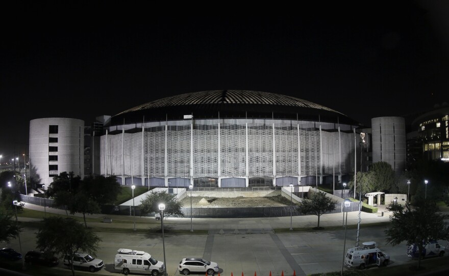 The Astrodome is illuminated on Tuesday. Voters in Houston rejected a bond referendum that would have allowed Harris County, Texas, to borrow $217 million that it could then spend on turning the into one very large convention and exhibition hall. The stadium is likely to be razed.