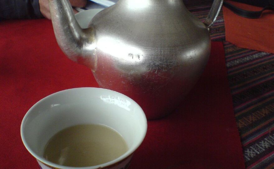 Yak butter tea is yellowish in color and has the consistency of soup.