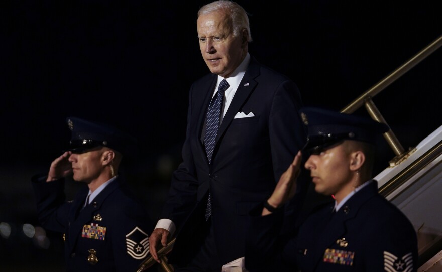 President Biden walks down the steps of Air Force One at Dover Air Force Base, Del., Thursday, June 2, 2022, as he heads to Rehobeth Beach, Del., for the weekend. A small plane flew near the Bidens' beach house.