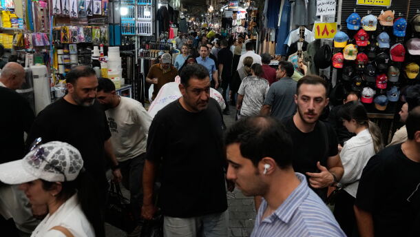 People walk in Tehran's traditional main bazaar, Iran, Saturday, Aug. 8, 2026.