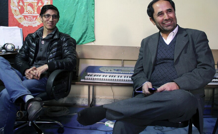 Royesh (right) visits music class.