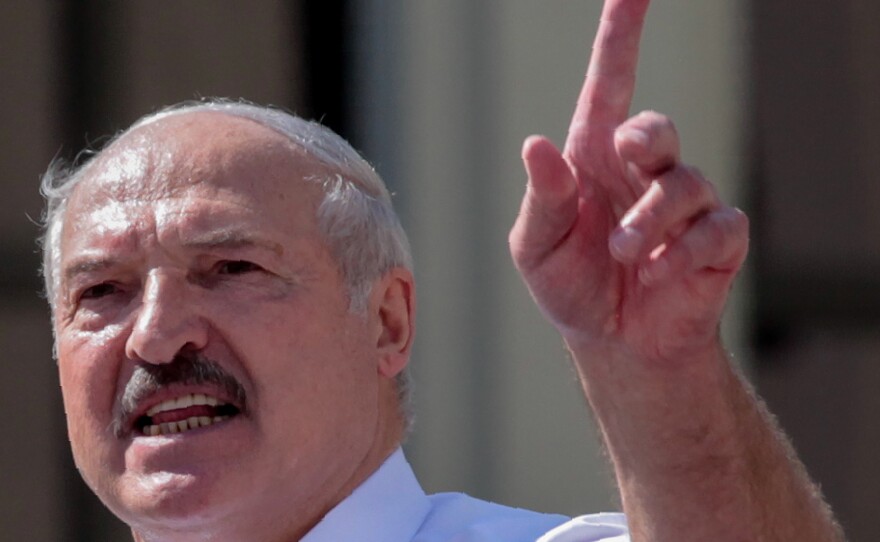 Belarus' President Alexander Lukashenko delivers a speech during a rally held to support him in central Minsk, on Aug. 16.