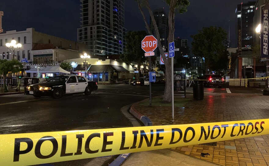 Police cars parked in the Gaslamp District following a fatal shooting, April 22, 2021.