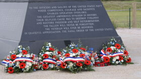 A 12-foot-tall bronze sculpture, created to honor the Navy’s efforts on D-Day, is unveiled at the highest point on Utah Beach in a 2008 ceremony attended by dignitaries, French citizens and the American veterans. 