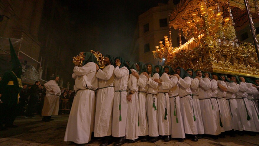 Throne-bearers carrying the Virgin of Hope during Semana Santa, Malaga, Spain.