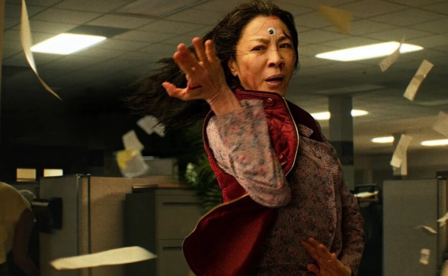 Michelle Yeoh stars as a woman who suddenly develops the power to leap between parallel universes in the action-adventure-fantasy <em>Everything Everywhere All at Once.</em>