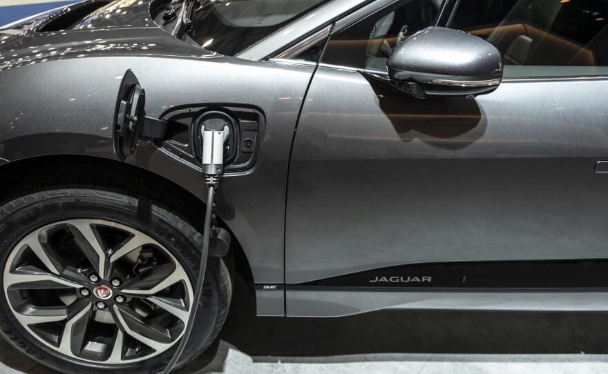 A Jaguar I-Pace, the first electric vehicle from the premium carmaker, charges during an event in Barcelona, Spain, in May.