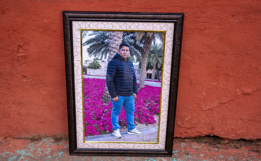 A photograph of Pritam Karki is displayed at his family's home in Nepal.