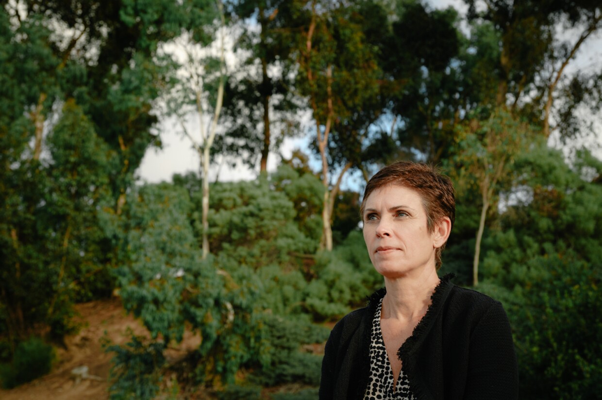 San Diego State University professor Elva Arredondo sits for a portrait at Sunridge Park in East Chula Vista on Oct. 31, 2023.