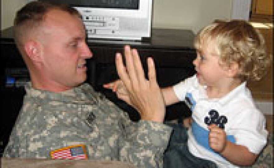 Andy DeUnger wrestles with his son, Drew, in the family room of their home in Hinesville, Ga. He leaves this month for a second tour in Iraq with the 3rd Infantry Division at Fort Stewart.