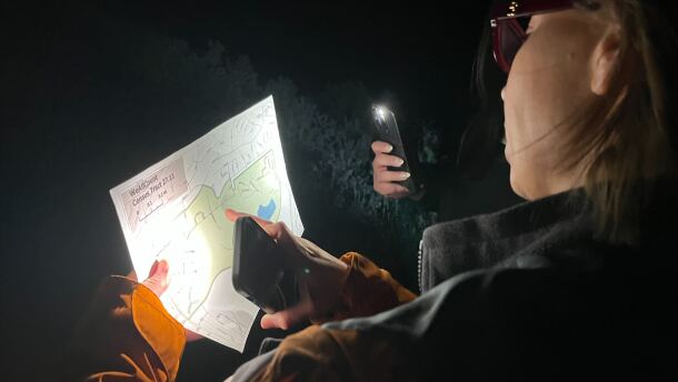 Volunteers for the Point-in-Time Count looking over their map as they search for unhoused individuals, Jan. 29, 2026.