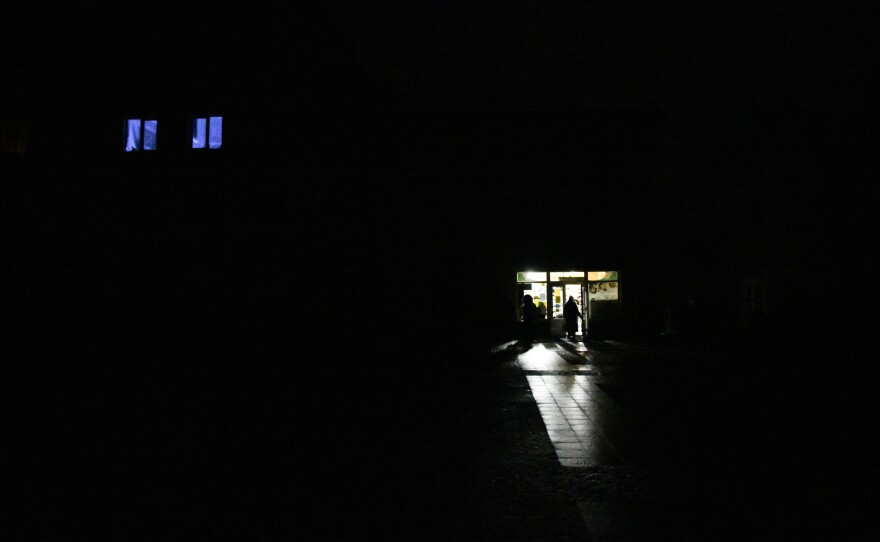 A storefront in Drohobych, Ukraine, during a power outage on Nov. 24. Russian shelling targeting electrical infrastructure across Ukraine resulted in blackouts in many cities.