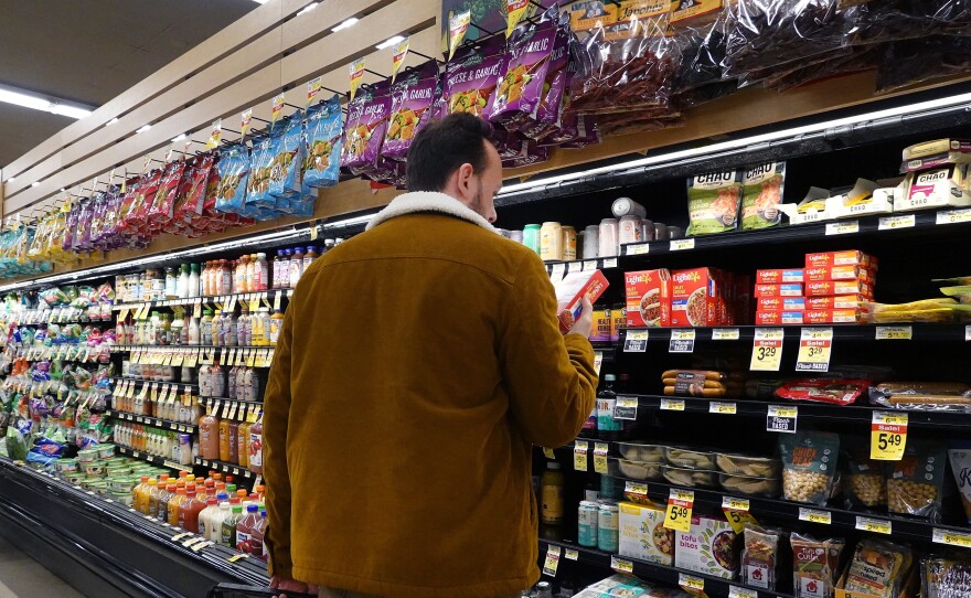 Customers shop for groceries in Chicago on Nov. 20, 2023. Annual inflation eased to 3.1% last month, helped in part by slower gains in gas and grocery prices.
