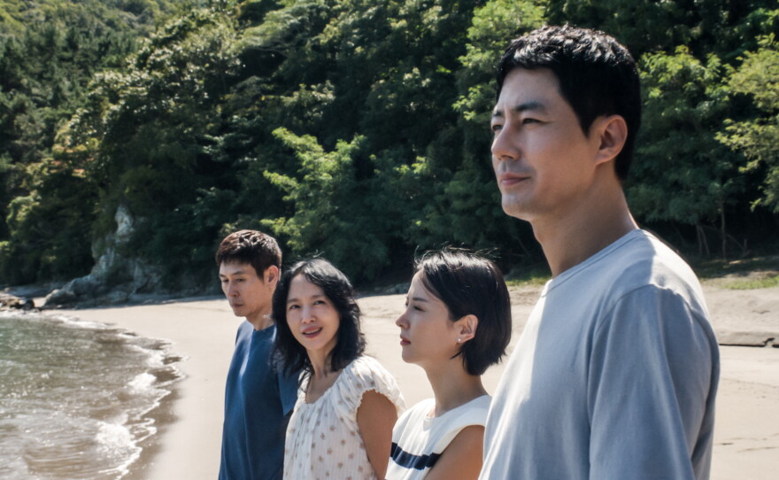 Sul Kyung-gu as Ho-seok, left, Jeon Do-yeon as Mi-ok, Cho Yeo-jeong as Ye-ji, Zo In-sung as Sang-woo in Possible Love. The film will release in select theaters Friday, and begin streaming on Netflix on Nov. 6