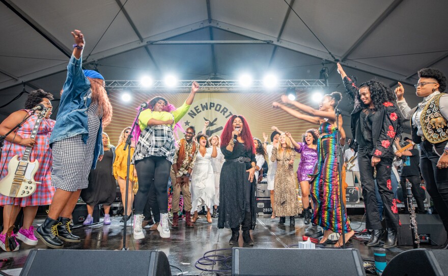 In 2021, following the release of her breakthrough album <em>Outside Child, </em>Allison Russell (seen here in rainbow jumpsuit, with her arms outstretched) organized the Newport Folk Festival's "superjam" featuring Chaka Kahn (at center) as well as Brandi Carlile, Joy Oladokum, Yola, Nathaniel Rateliff, Margo Price, Adia Victoria and others.