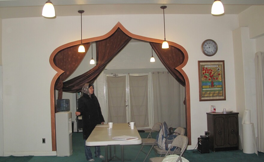 Naeema, Amir Carr's wife, stands in the masjid's archway.