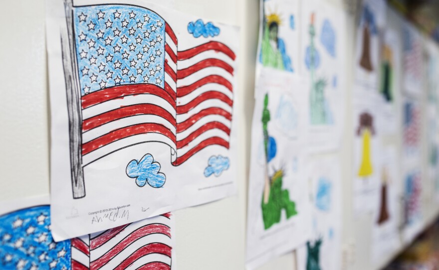 Colored drawings of the American flag and the Statue of Liberty are taped to a wall in a newcomers classroom at Emerald Middle School in El Cajon, April 23, 2017.