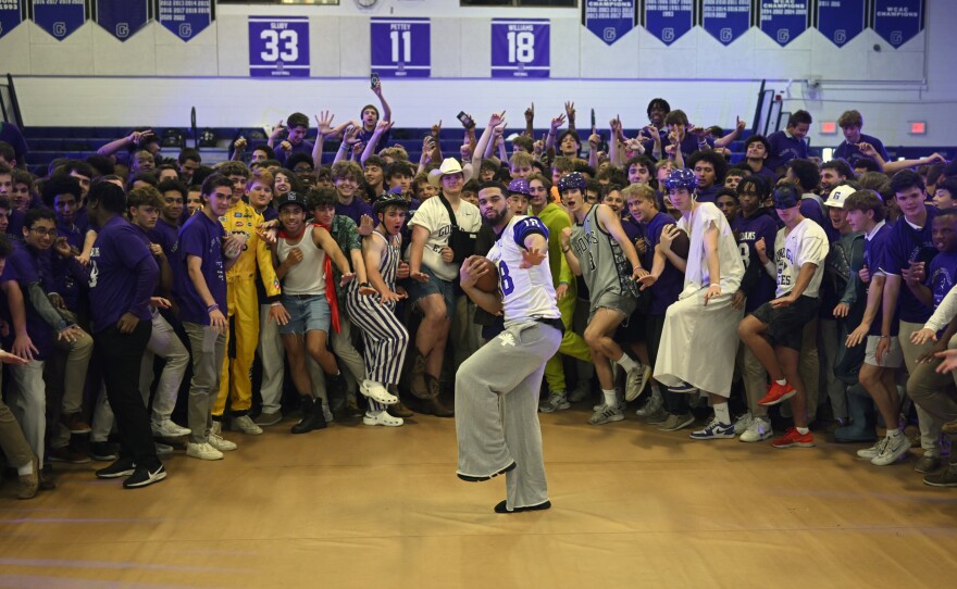 Heisman Trophy winner Caleb Williams visited his high school alma mater Gonzaga to attend a pep rally to honor the USC quarterback for his award. Williams, center strikes a Heisman pose along with members of the student body in the school's gym on May 19, 2023 in Washington, DC.