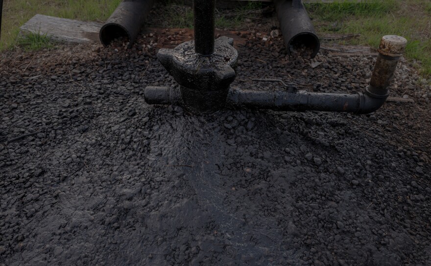 The base of one of Scott Robinowitz's marginal wells shows built-up oil. The wells produce just a few barrels a day, but that small volume can still be profitable. Keeping operating costs low is key to making money on marginal wells, creating tension between environmental groups who want more active monitoring for pollution risks and companies that want to keep costs down.