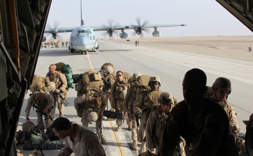 U.S Marines board a C-130 and prepare to depart Camp Leatherneck. All the Marines are departing from southern Afghanistan, but around 20,000 U.S. military personnel remain in the country.