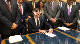 California Gov. Gavin Newsom signs a law overhauling charter schools on Thursday, Oct. 3, 2019, in Sacramento, Calif.
